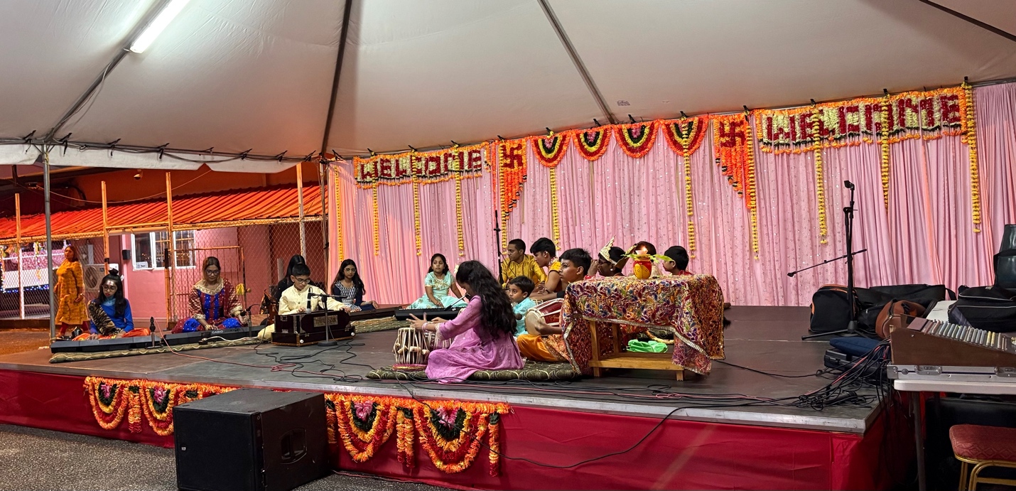 Young performers sharing music during a Divali celebration